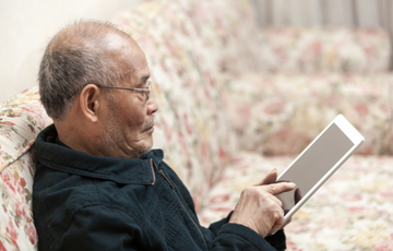 image of man on tablet