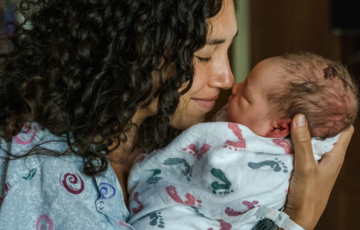 mother holding baby
