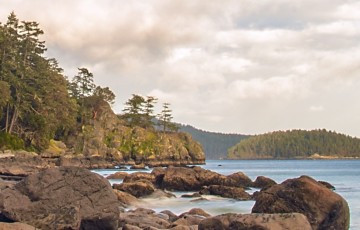 landscape of rocks, water and trees