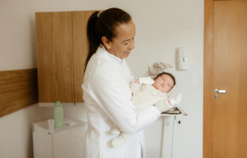 doctor holding a newborn baby