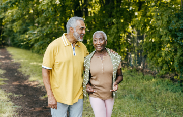 two people walking and smiling